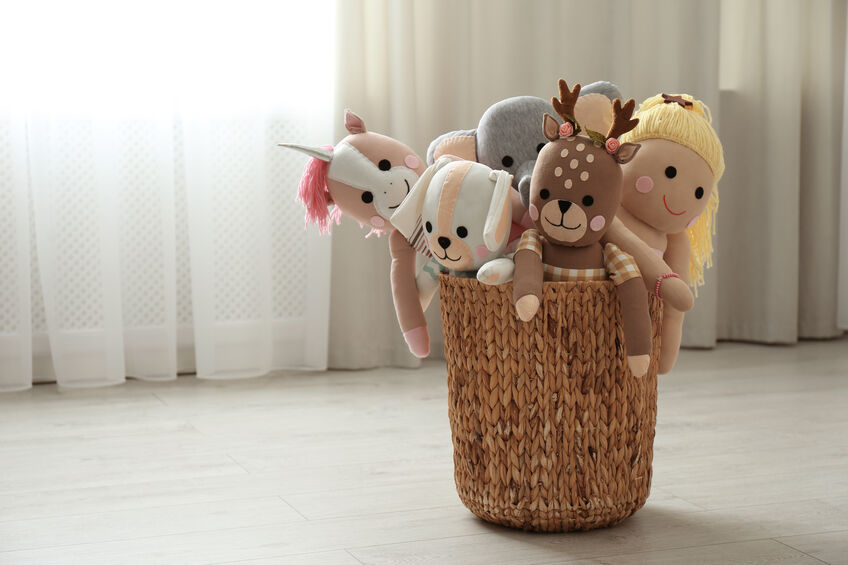stuffed animals in a basket