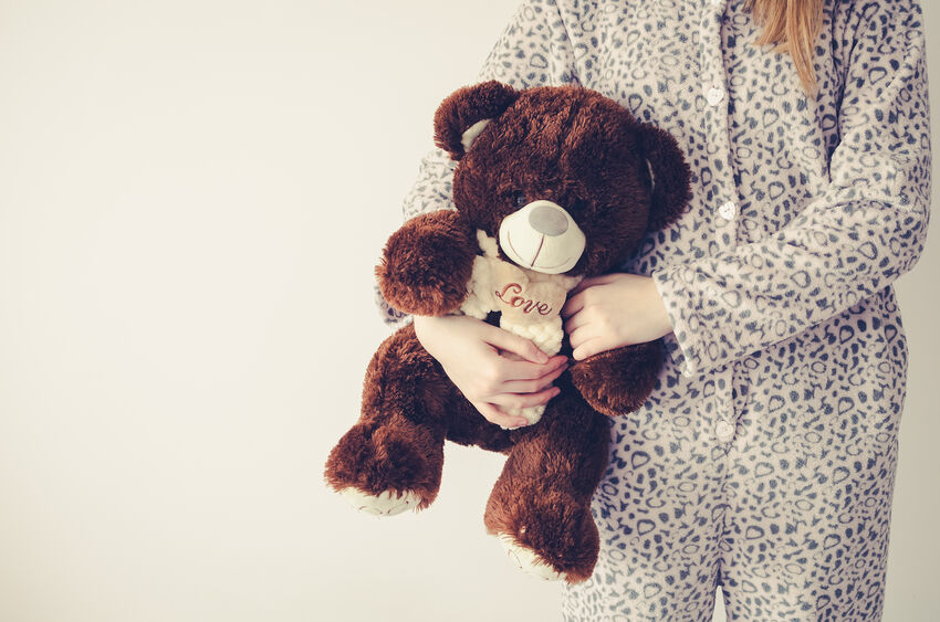 Teen girl with teddy bear