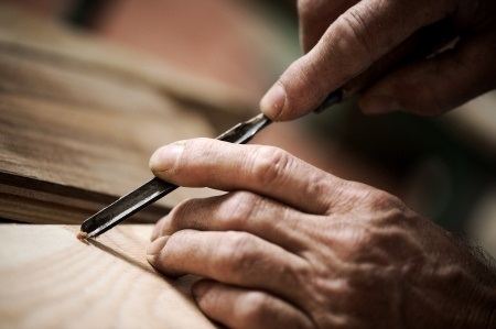 Woodworker Carving a Piece of Wood