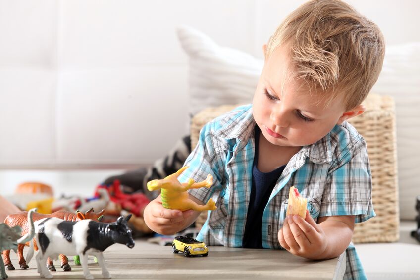 child playing with toys in living room