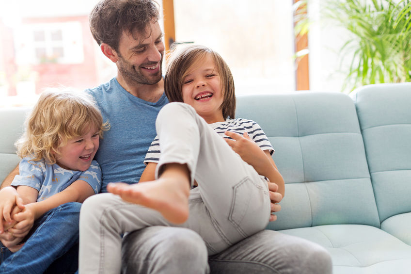 father playing with children