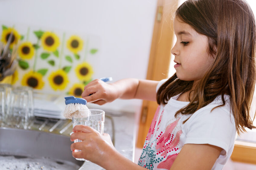 young girl doing chores