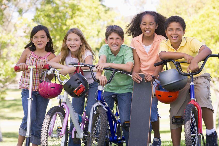 group of kids on bikes smiling