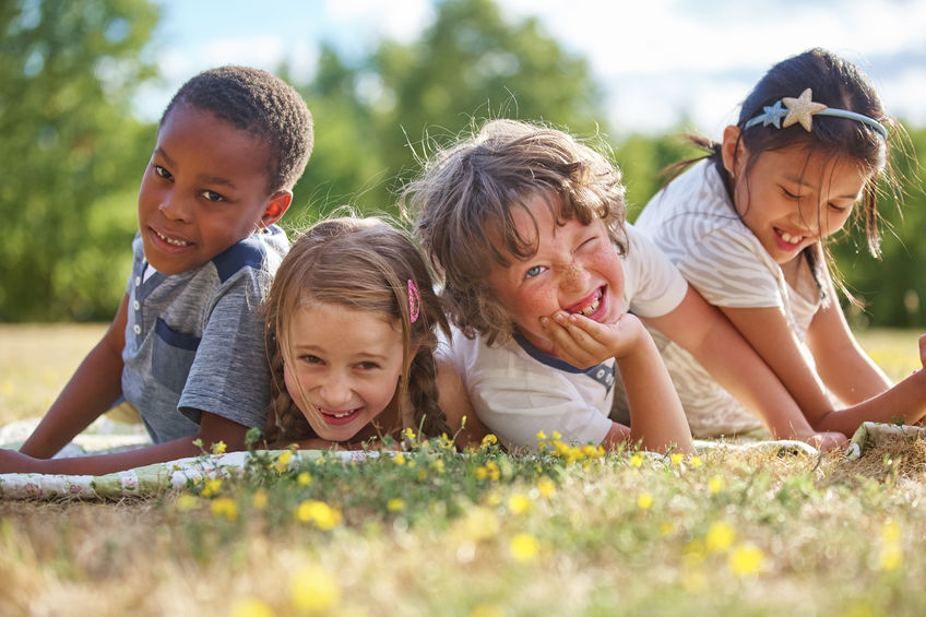 kids having fun in the nature and smiling