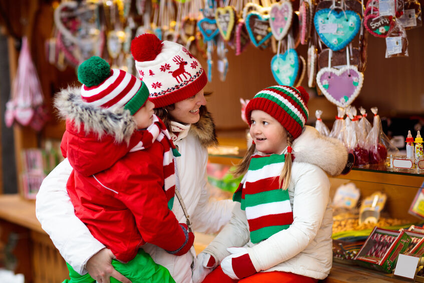 mother christmas shopping with her two daughters